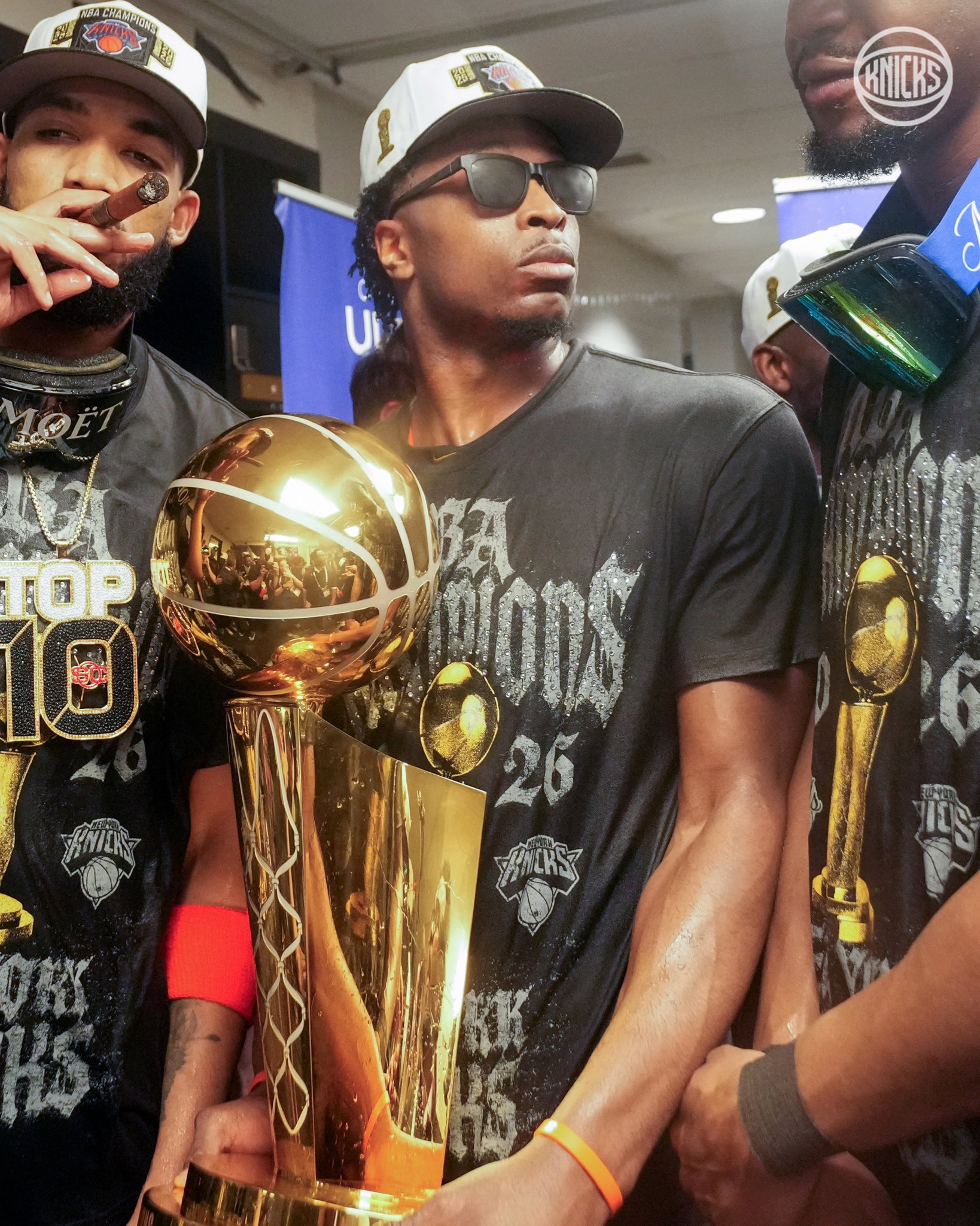 Jalen Brunson in the locker room with the Larry O'Brien Trophy